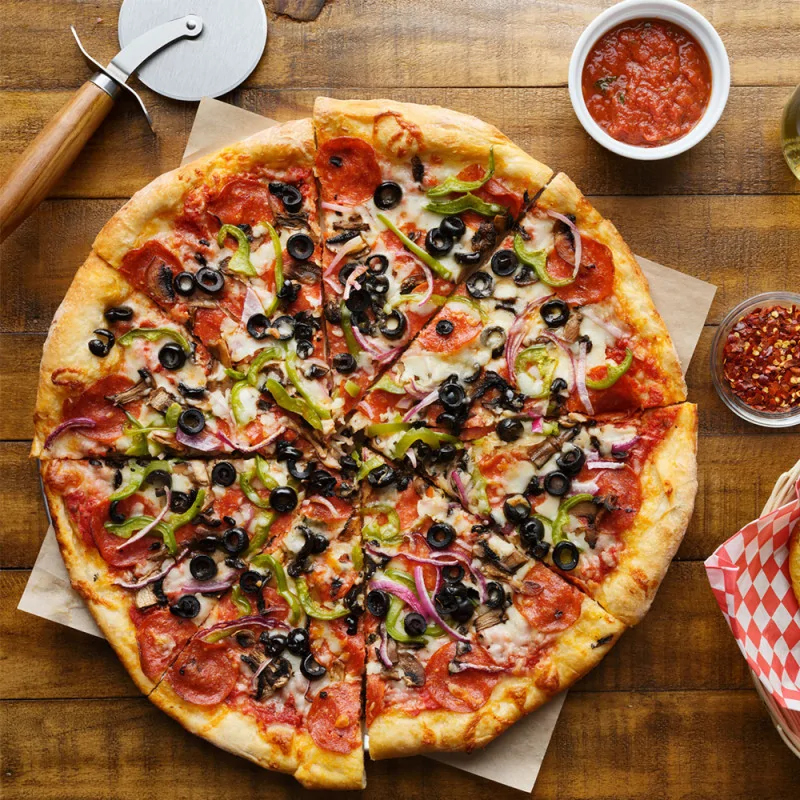 Plaque à pizza perforée en acier anti-adhérent Ø30cm ambiance